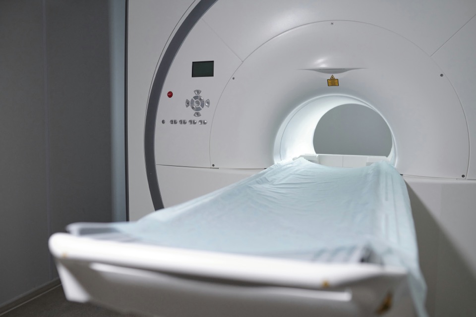 An MRI suite with the scanner bore and a prepped table